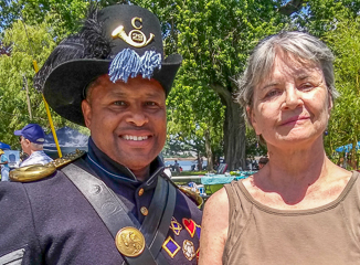 Civil War Re-Enactor Warren Barnet, representing the 29th Regiment, and Carol Leary of the Stop Bullying Coalition