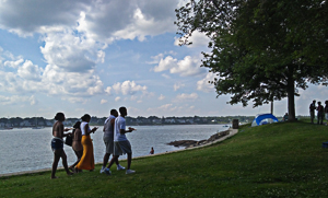 Strong in spirit, we are on the march: youth walking at shore