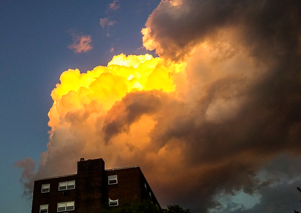 Dramatic clouds over apartment building