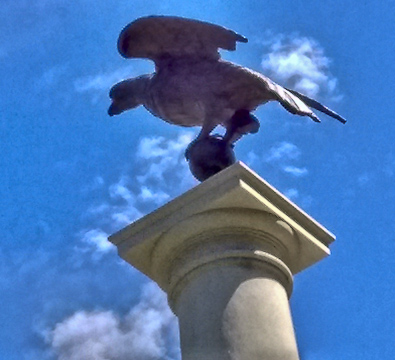 Statue of eagle on column at State House