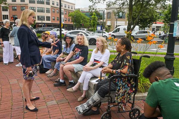 Senator Joan B. Lovel, standing, chats with constituents