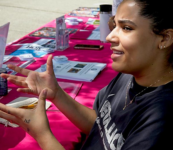 Young woman gesturing as she speaks