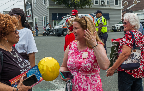 Tami Gouveia, Candidate for Lieutenant Governor, talks with a voter.