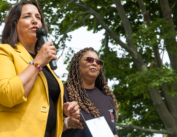 Mayor Kim Driscoll and Joyce Joy Kaye. Kaye is the daughter Melvin Gleason, designer of the black American Heritage Flag of 1967