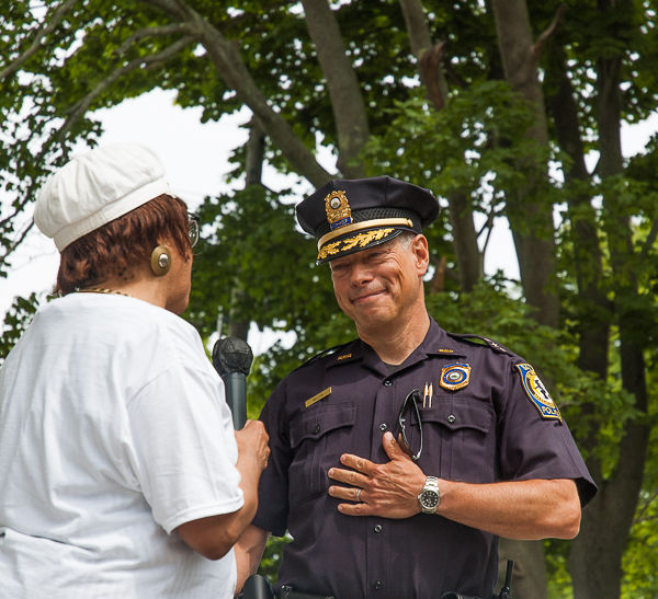 Doreen Wade presents Chief Miller with framed artwork.